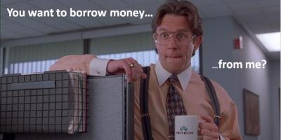 Man wearing a shirt and tie holding coffee