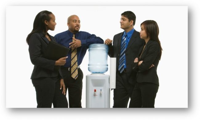Office workers around watercooler